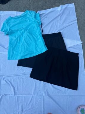 crown & ivy Bright Turquoise T-shirt with two black athletic skirts
